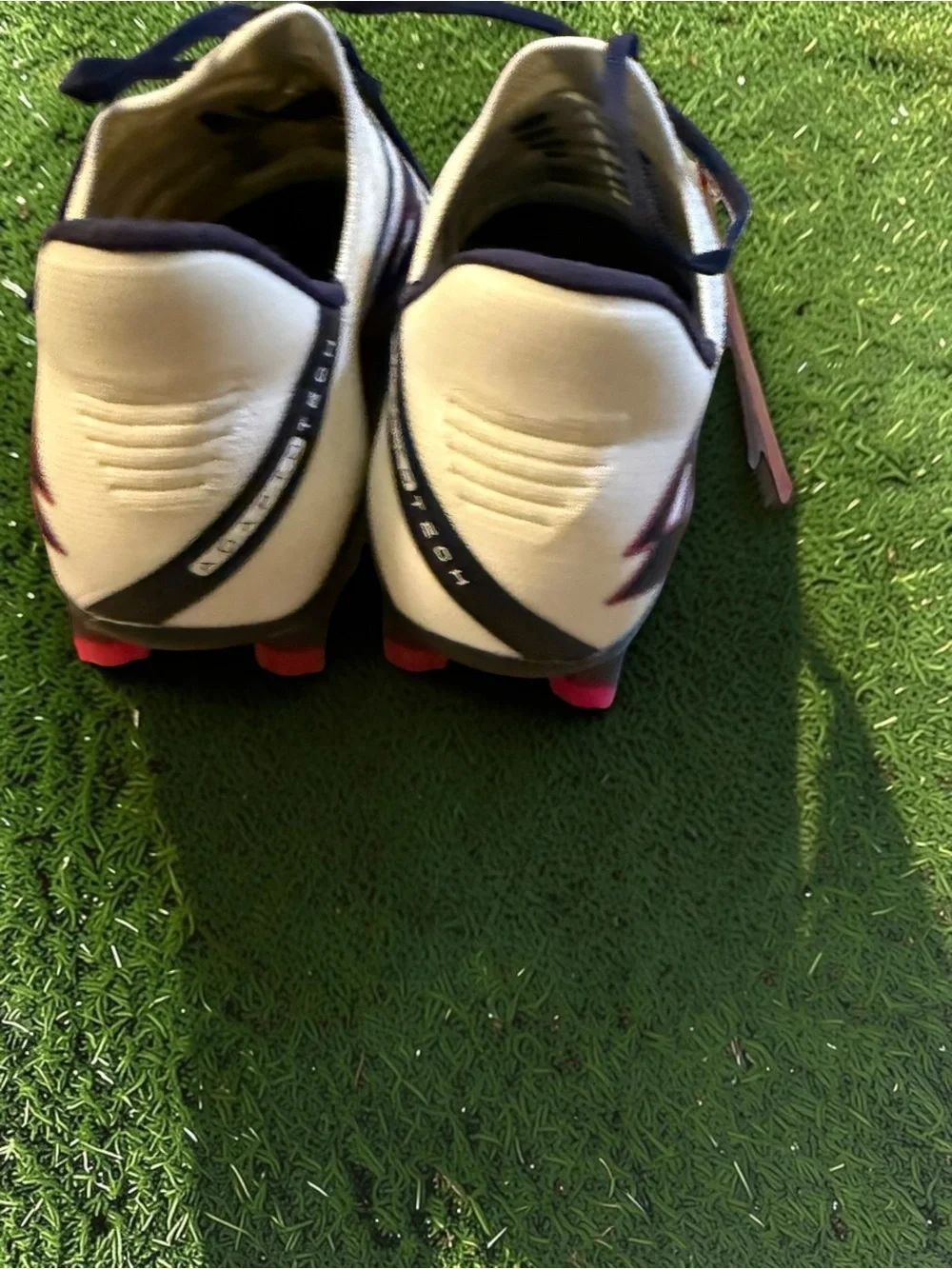 Lotto Maestro 100 IV FG soccer cleats in white with blue and pink details. -nwt